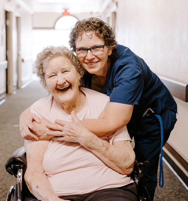 Happy Elder with Staff Member at Greenhurst Nursing Center